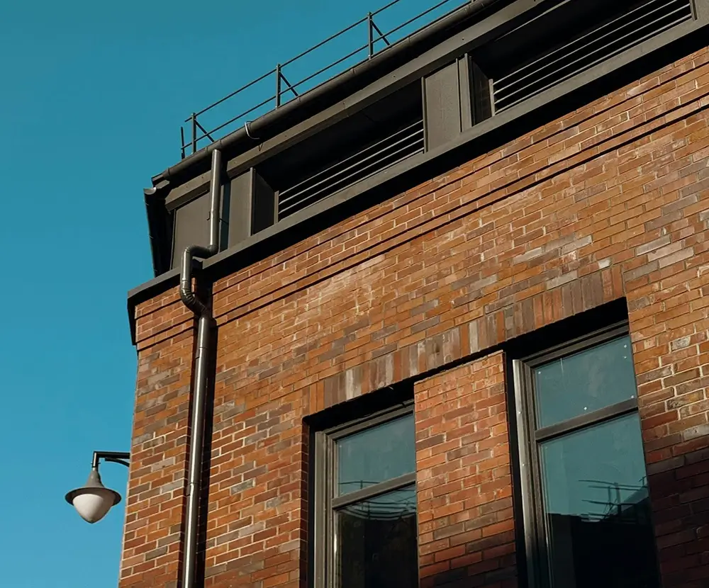 Gutters on side of brick building