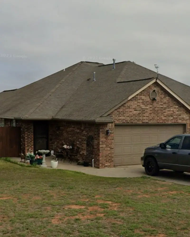 A house before the exterior was painted and roof replaced