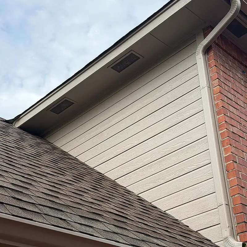 A home exterior wall with fresh tan siding