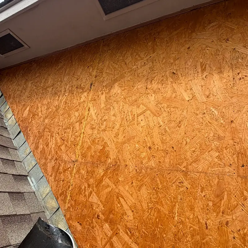 The bare wood wall of a house before siding is added