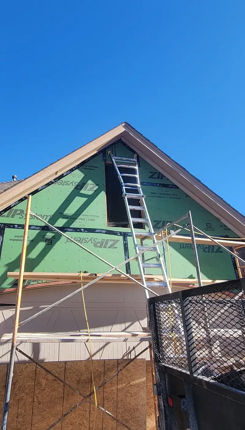 The front of a home stripped to the foundation